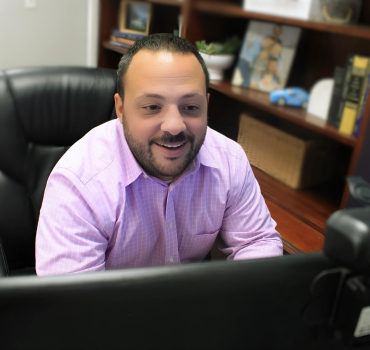 tyler meyer, cpf in a virtual financial planning meeting with a non kansas client